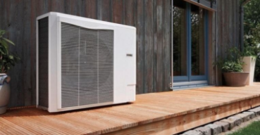 An externally mounted home unit sitting on a back deck of the house, providing efficient air conditioning.