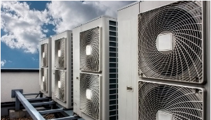 An image of a commercial HVAC system that is mounted on the roof of an industrial building in Daytona, Florida