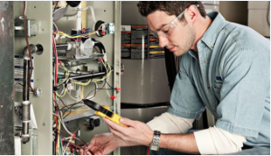 A technician uses specialized equipment to monitor and record the effectiveness of heating and cooling equipment. 
